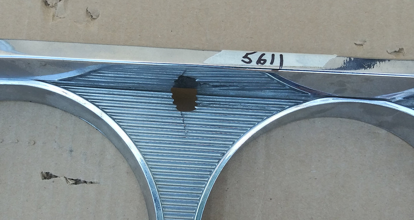 1964 Chrysler Newport headlight bezels pair