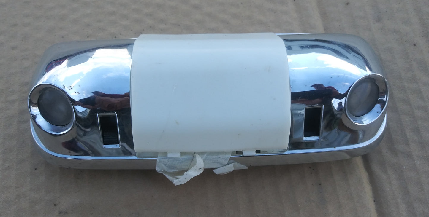 1970s Ford interior light with reader lights.